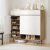 Modern shoe cabinet with open doors displaying shoes and decor items in a room.