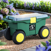 Green garden storage box with yellow wheels on a garden path