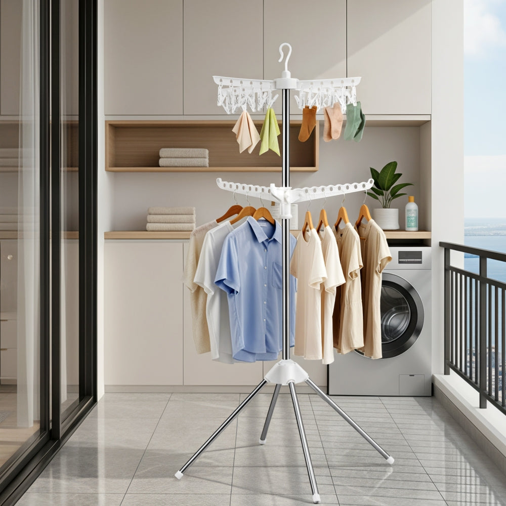 Clothes drying rack with clothes in a laundry room.