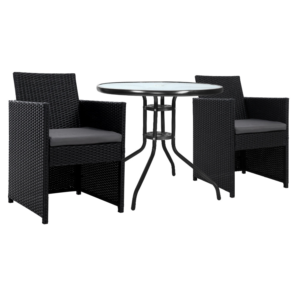 Black wicker outdoor furniture set with a round glass table on a white background