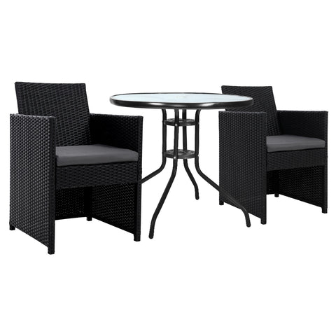 Black wicker outdoor furniture set with a round glass table on a white background