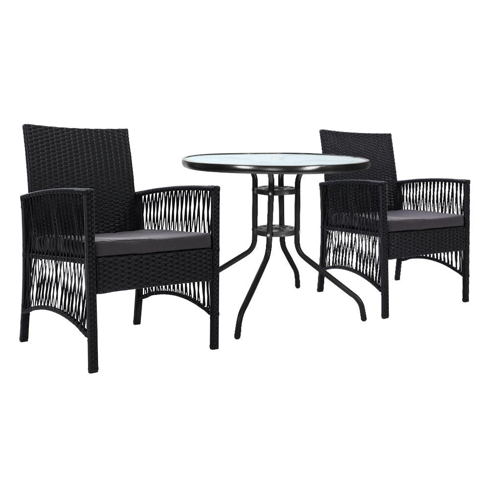 Black wicker dining set with round table and chairs on a white background