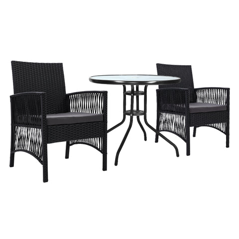 Black wicker dining set with round table and chairs on a white background