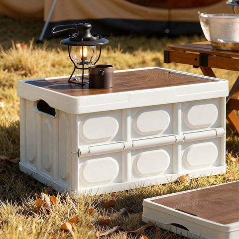 White storage crate with wooden top and lantern on grass